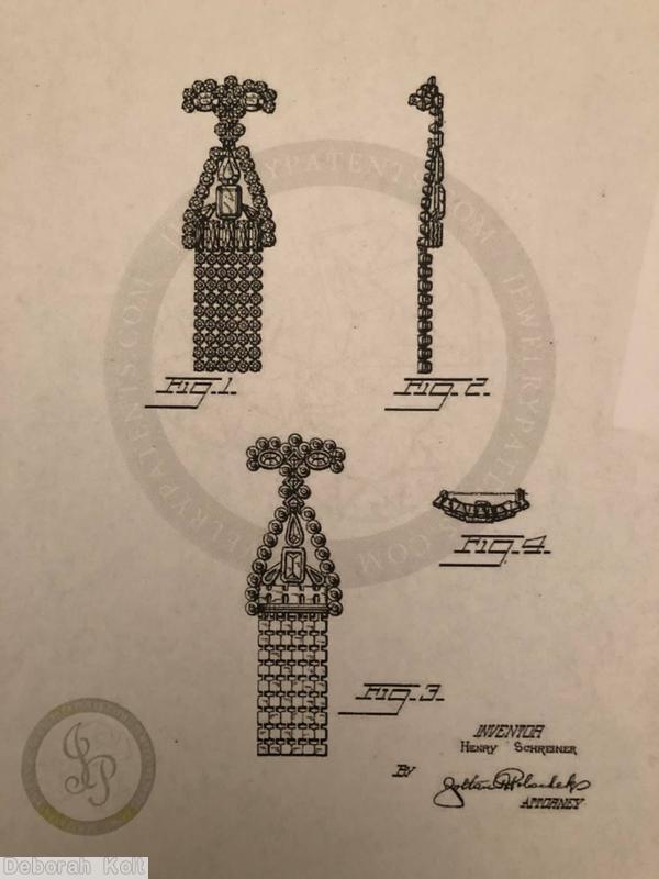 Schreiner top down long fringe pin top bar shape 2 large oval stone 12 surrounding small chaton middle triangle shape large teardrop large emerald cut center 5 baguette small chaton border 6 fringe of 9 chaton crystal goldtone jewelry