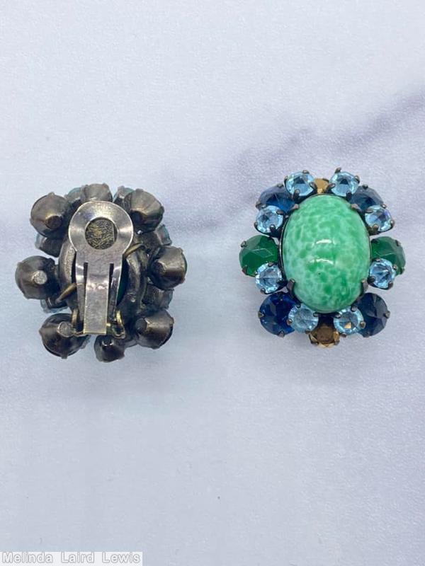 Schreiner 1 large oval cab center 16 surrounding small stone large oval peking glass center emerald chaton inverted small ice blue navy metalic brown chaton jewelry