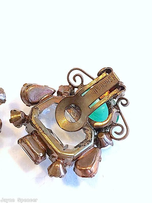 Schreiner asymmetrical scrollwork earring 1 large emerald cut 1 large oval cab 3 faux pearl 2 small teardrop 2 small chaton 1 small buguette large crystal faceted emeral cut marbled green large oval cab copper back jewelry
