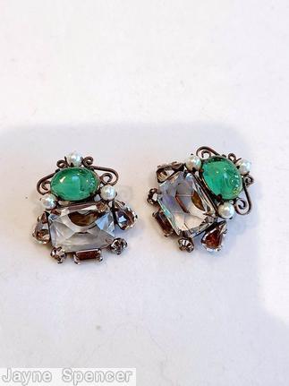 Schreiner asymmetrical scrollwork earring 1 large emerald cut 1 large oval cab 3 faux pearl 2 small teardrop 2 small chaton 1 small buguette large crystal faceted emeral cut marbled green large oval cab copper back jewelry