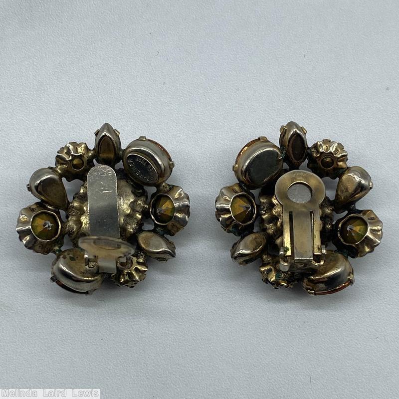 Schreiner domed radial earring large oval stone center 9 surrounding stone varied shape large ruby oval faceted stone brown metalic oval stone ruby teardrop crytal chaton goldtone jewelry