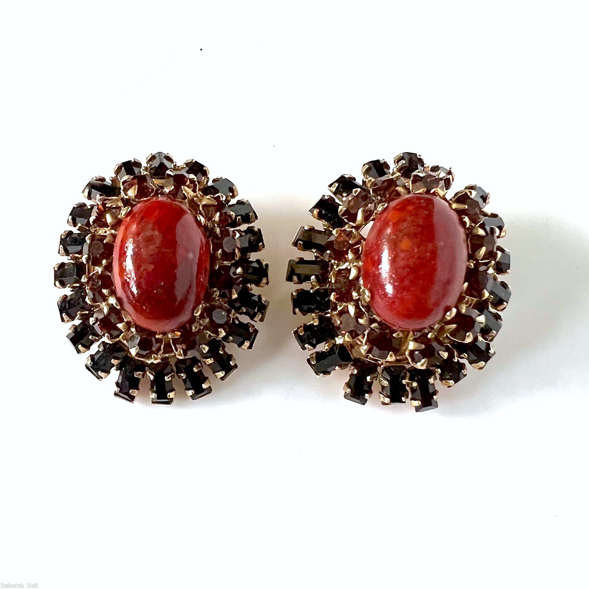 Schreiner domed radial oval earring hook eye 2 rounds large oval cab center 12 surrounding small chaton 19 baguette outside marbled red large oval cab dark red small chaton jet small baguette goldtone jewelry