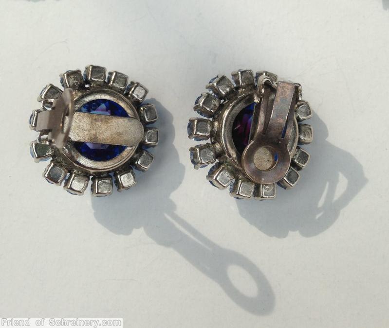 Schreiner large chaton surrounded by 14 small chaton bicolor ruby sapphire large faceted open back chaton ice blue small inverted chaton jewelry