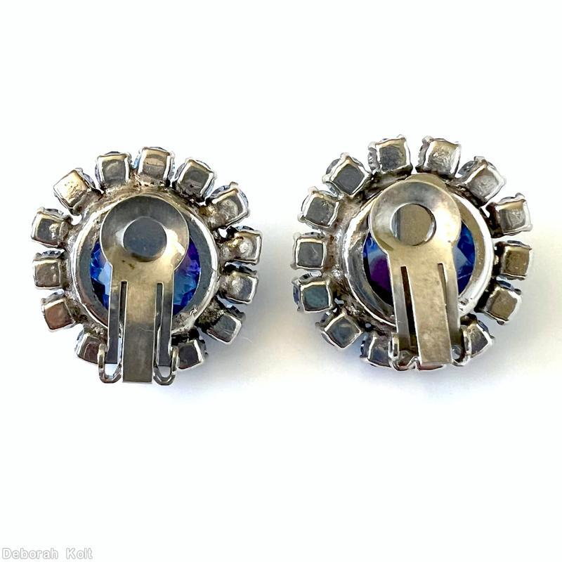 Schreiner large chaton surrounded by 14 small chaton bicolor ruby sapphire large faceted open back chaton ice blue small inverted chaton jewelry