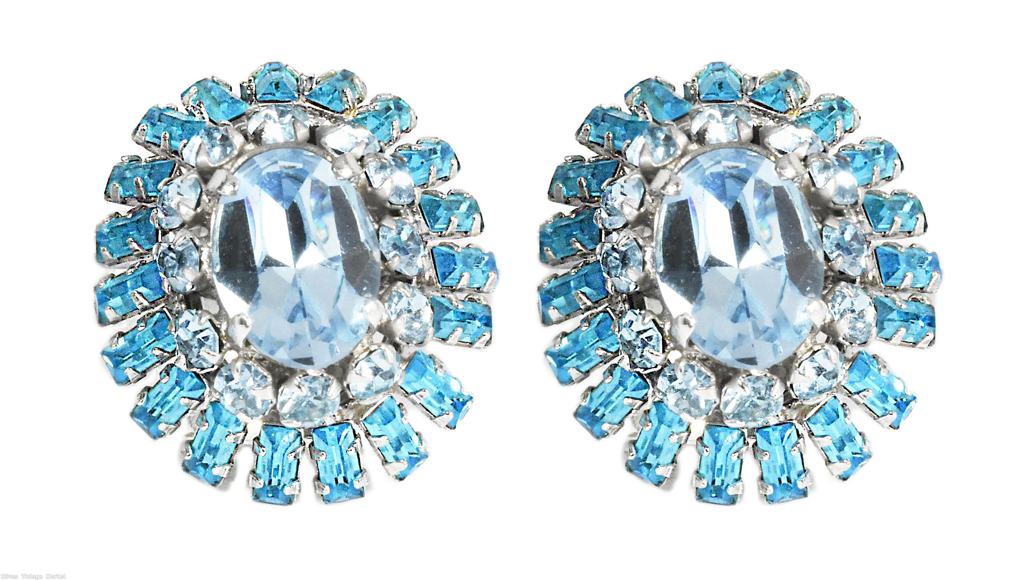 Schreiner oval shaped 2 surrounding level domed earring large oval center 12 small surrounding stone 2nd round small baguette ice blue clear faceted large oval center ice blue small chaton aqua clear small baguette silvertone jewelry