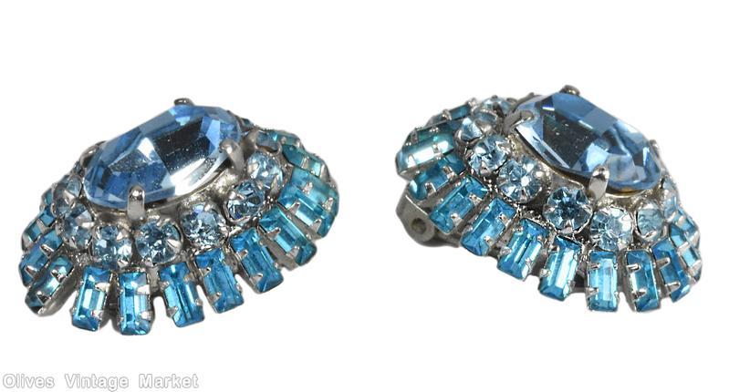 Schreiner oval shaped 2 surrounding level domed earring large oval center 12 small surrounding stone 2nd round small baguette ice blue clear faceted large oval center ice blue small chaton aqua clear small baguette silvertone jewelry