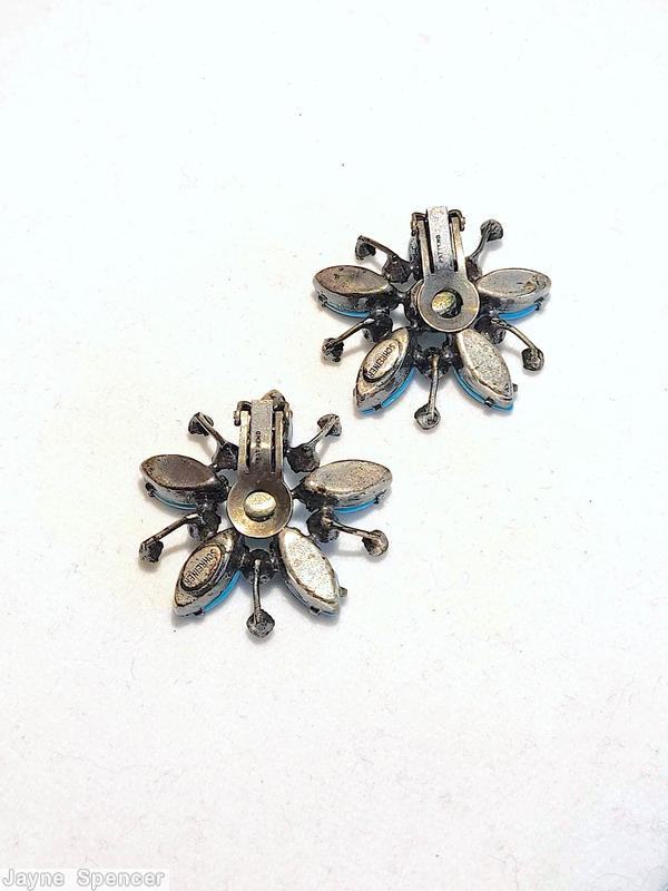 Schreiner radial spoke earring 1 round stone center 5 surrounding navette 5 short stem small chaton end opaque babyblue navette ice blue faceted round stone center ice blue small chaton silvertone jewelry