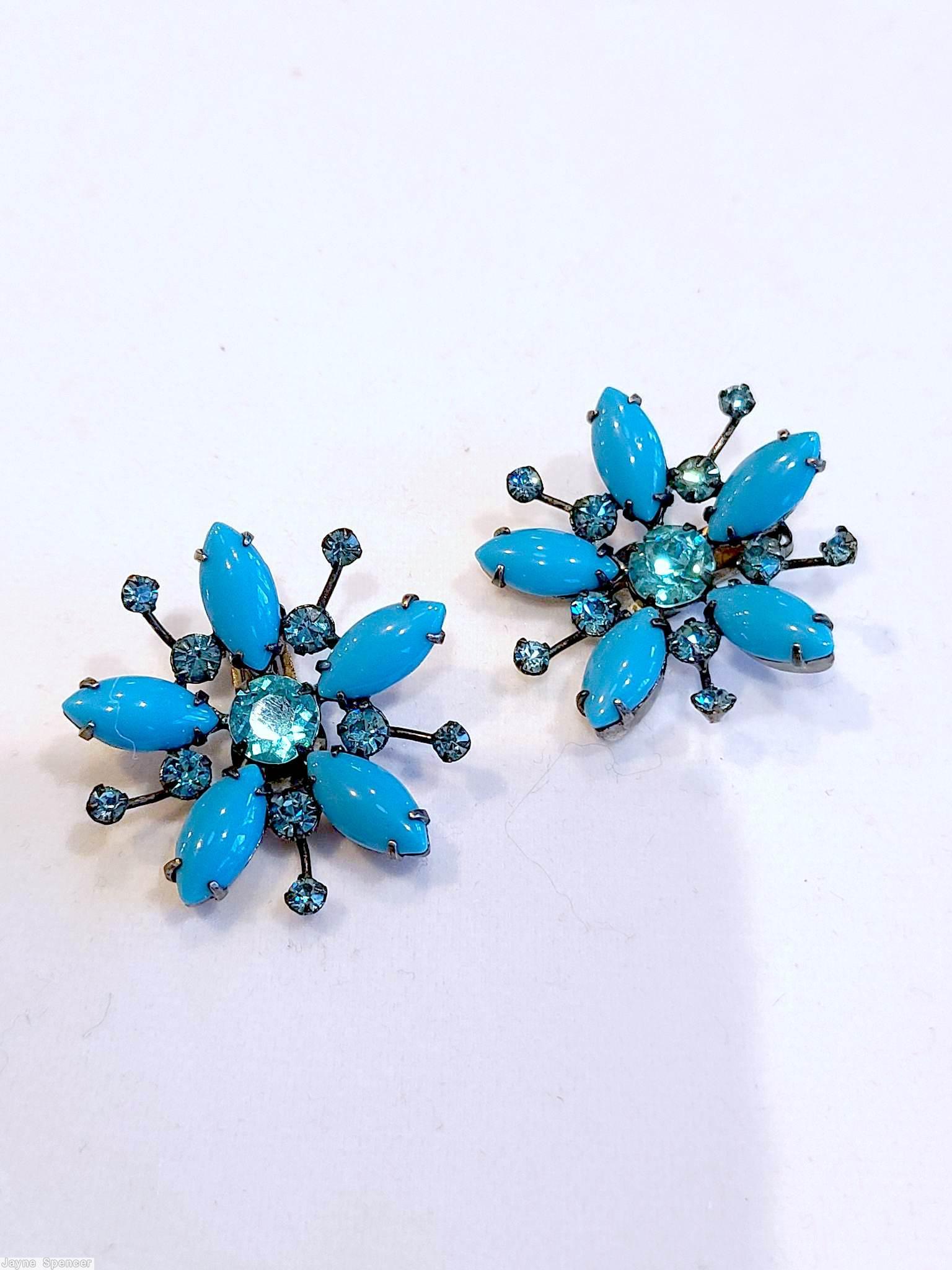 Schreiner radial spoke earring 1 round stone center 5 surrounding navette 5 short stem small chaton end opaque babyblue navette ice blue faceted round stone center ice blue small chaton silvertone jewelry