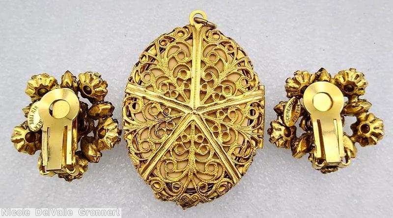 Schreiner 2 flower head radial locket 7 navette 15 chaton scrollwork ruby red goldtone jewelry