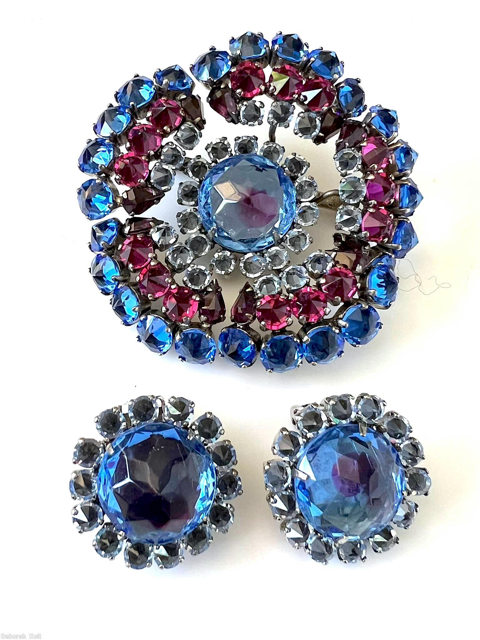 Schreiner 5 petal of many small inverted stone large faceted chaton center blue fuchsia ice blue bicolor ruby blue jewelry