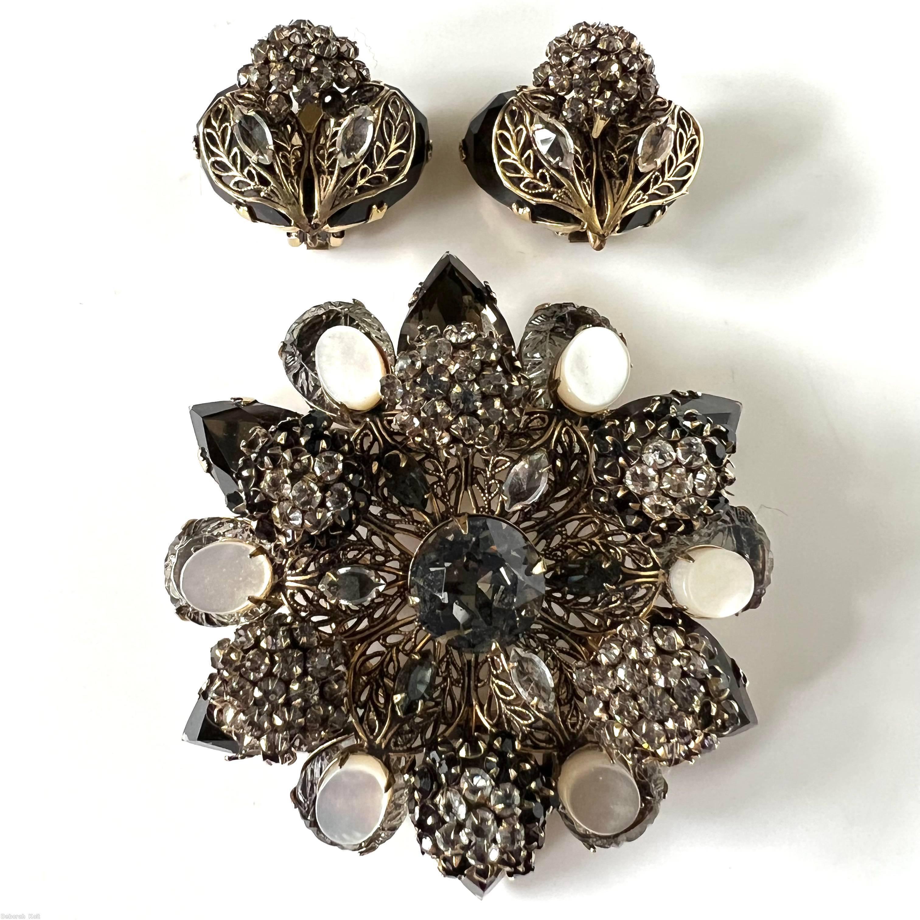 Schreiner 6 clustered ball filigree 2 level radial pin 6 large teardrop large round stone center smoky large faceted round stone center moonglow white oval cab clustered ball of smoky crystal inverted small stone jet large faceted teardrop smoky teardrop cracked ice goldtone jewelry