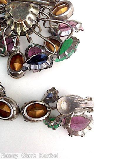 Schreiner 8 large carved leaf 4 small carved leaf sprawling 18 branch radial random arranged pin large oval center purple large carved leaf green large carved leaf navy large carve leaf peridot large oval facted stone crystal large oval faceted stone jewelry
